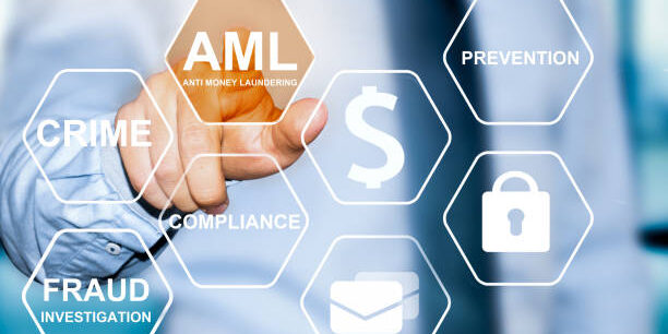 hand touching button with AML anti money laundering symbol